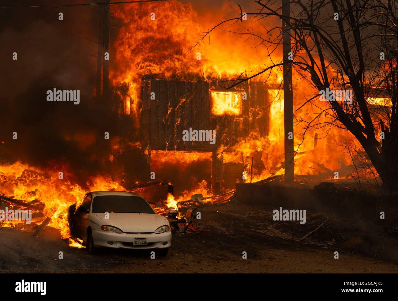 United States. 05th Aug, 2021. A home burns on Highway 89 south of Greenville, California, near Forgay Road during the Dixie fire on August 5, 2021. (Photo by Nathaniel Levine/Sacramento Bee/TNS/Sipa USA) Credit: Sipa USA/Alamy Live News Stock Photo