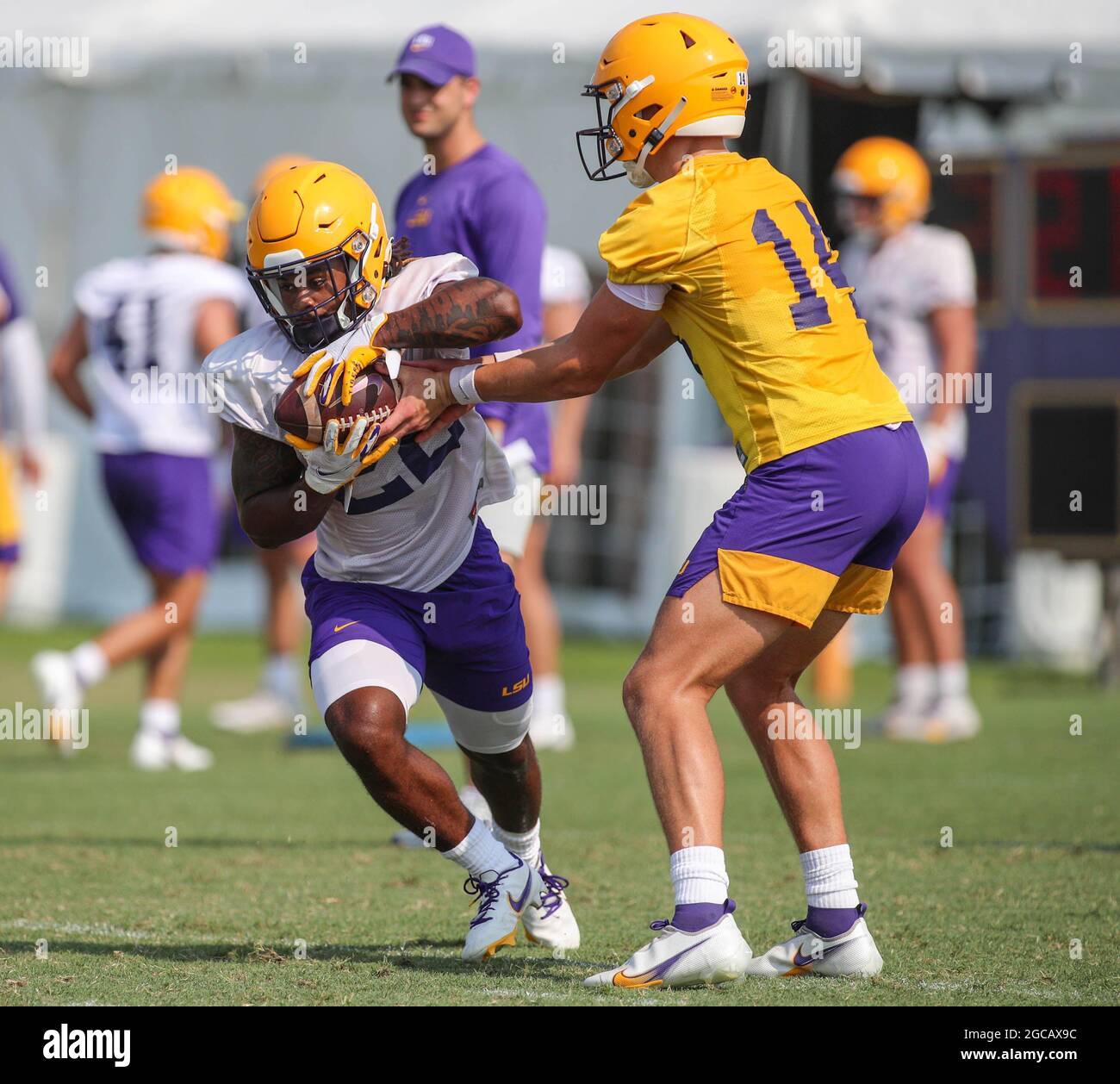 August 7 21 Lsu Quarterback Max Johnson 14 Works A Hand Off Drill With Running Back Armoni Goodwin 22 During The First Week Of Fall Football Camp At The Lsu Charles Mcclendon August 7 21 Lsu Quarterback Max Johnson 14 Works A Hand Off Drill With Running Back Armoni Goodwin 22 During The First Week Of Fall Football Camp At The Lsu Charles Mcclendon