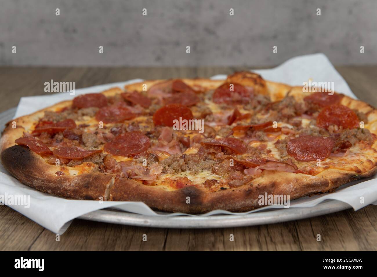 Meat lovers pizza loaded with pepperoni, sausage, hamburger, and