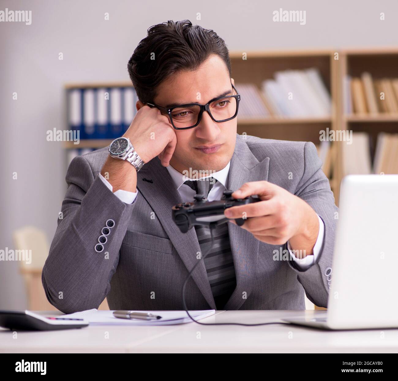 The businessman playing computer games at work office Stock Photo - Alamy