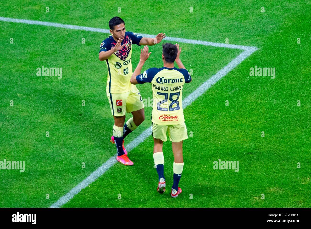 Salvador Reyes (L) of America celebrates after scoring during the Apertura  tournament soccer match between Club America and Club Puebla at Azteca  stadium in Mexico City, Mexico, 07 August 2021. EFE/Carlos Ramirez