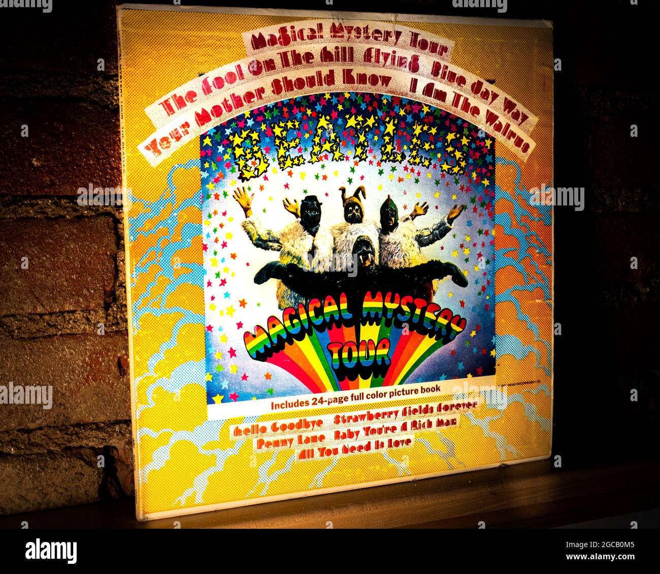 Closeup of The Beatles Magical Mystery Tour Vinyl Record Cover Leaning Against Brick Wall Stock Photo