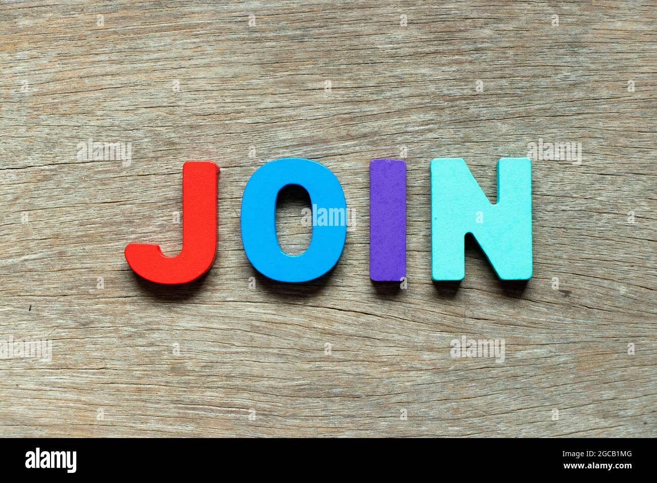 Color alphabet letter in word join on wood background Stock Photo - Alamy