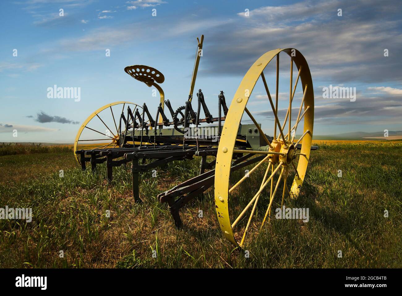 A vintage piece of agriculture equipment on a Canadian prairies farm in Alberta Canada Stock