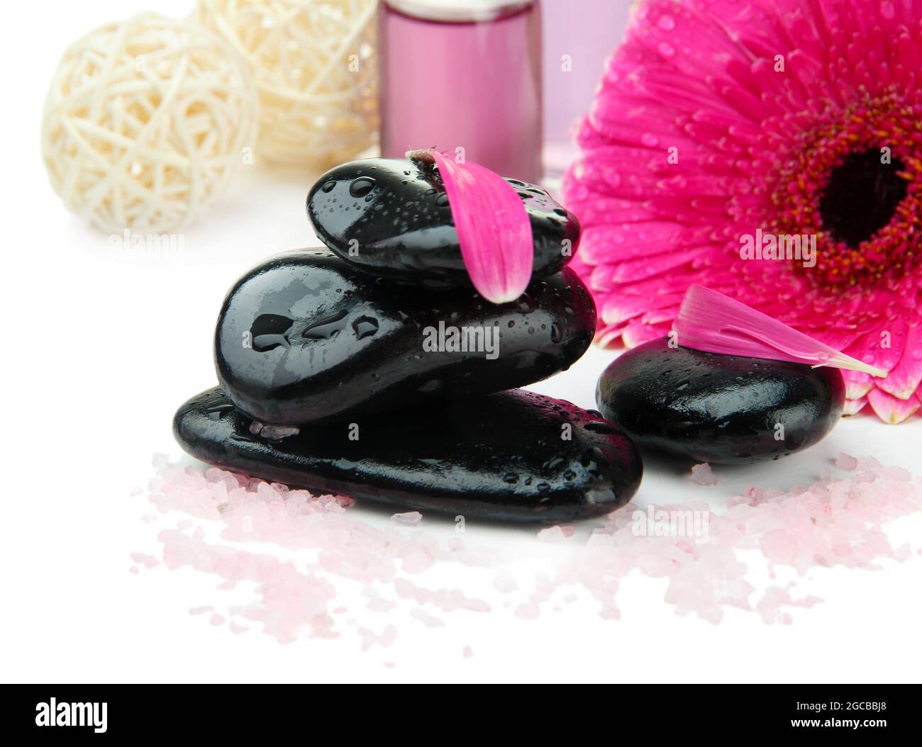 Spa stones and gerbera isolated on white Stock Photo - Alamy