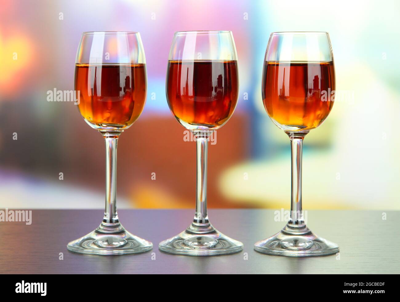 Glass of amaretto liquor, on bright background Stock Photo Alamy