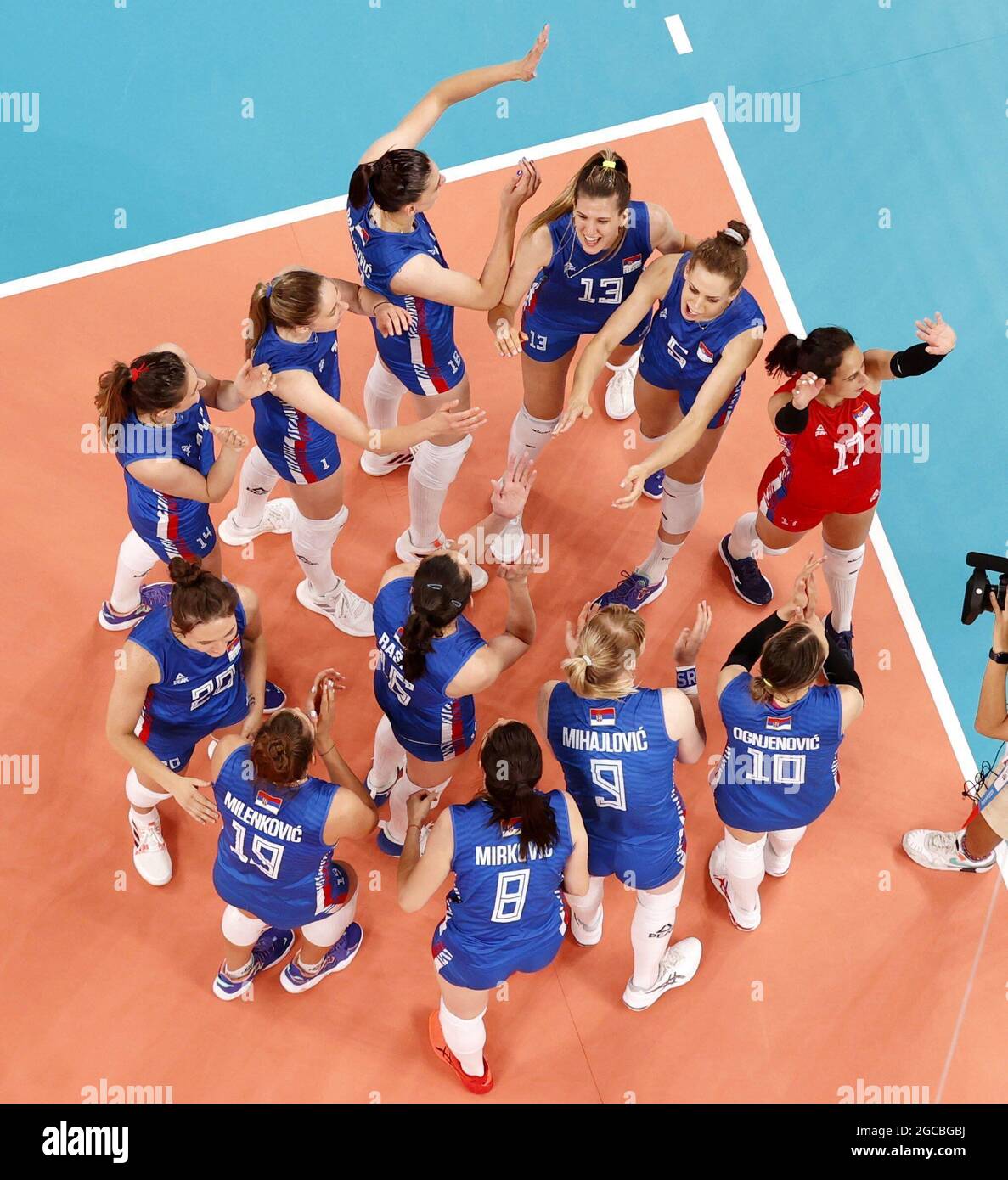 Serbian players celebrate after defeating South Korea in the women's