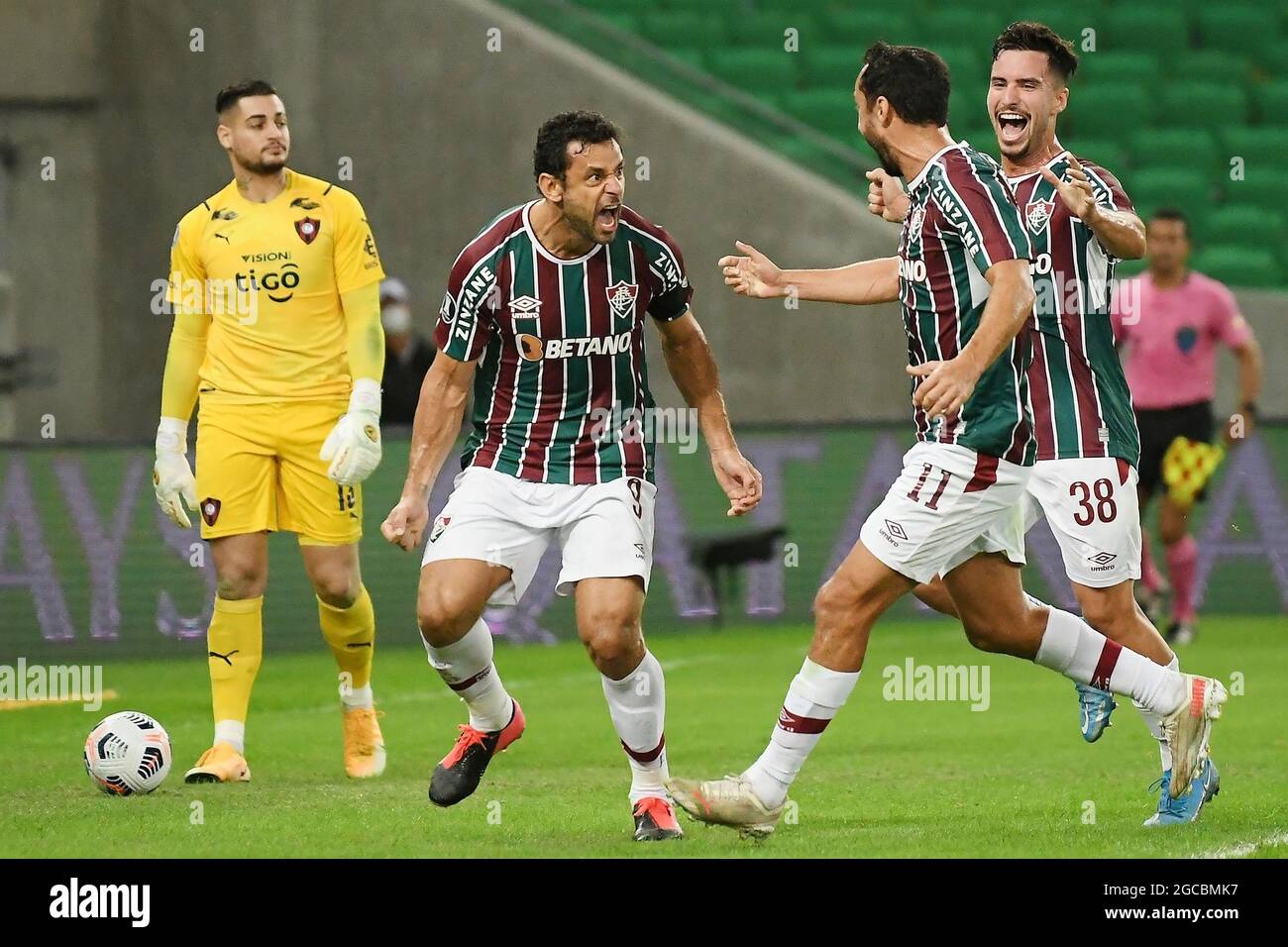 Brazilian Ronaldinho Gaucho jumps over his teammates to celebrate