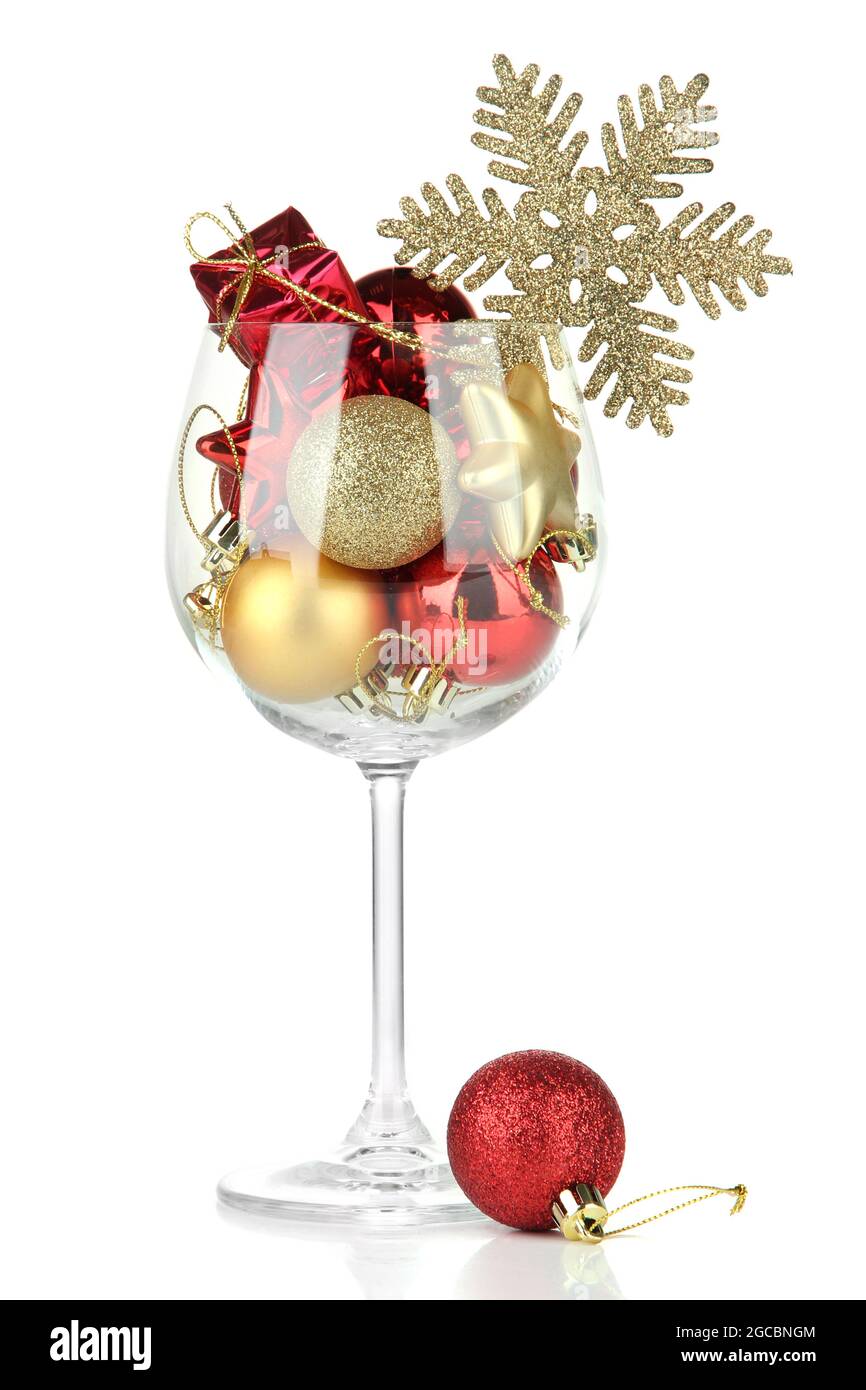 https://c8.alamy.com/comp/2GCBNGM/wine-glass-filled-with-christmas-decorations-isolated-on-white-2GCBNGM.jpg