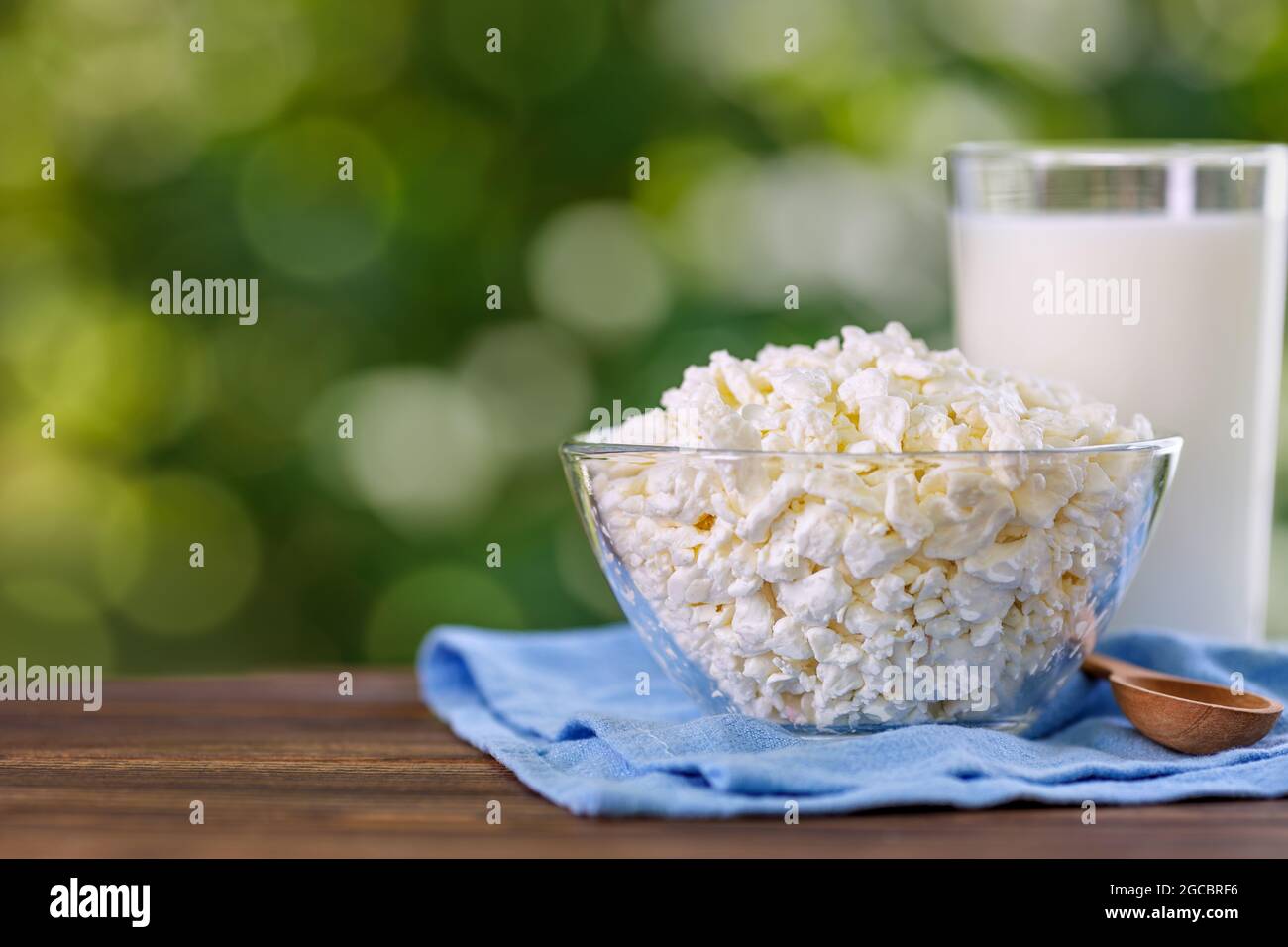 yogurt and cottage cheese on table outdoors Stock Photo