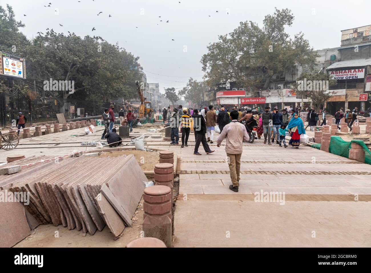 View of redevelopment work going on at Chandni Chowk area in old Delhi, tiles being laid on pavement. Stock Photo