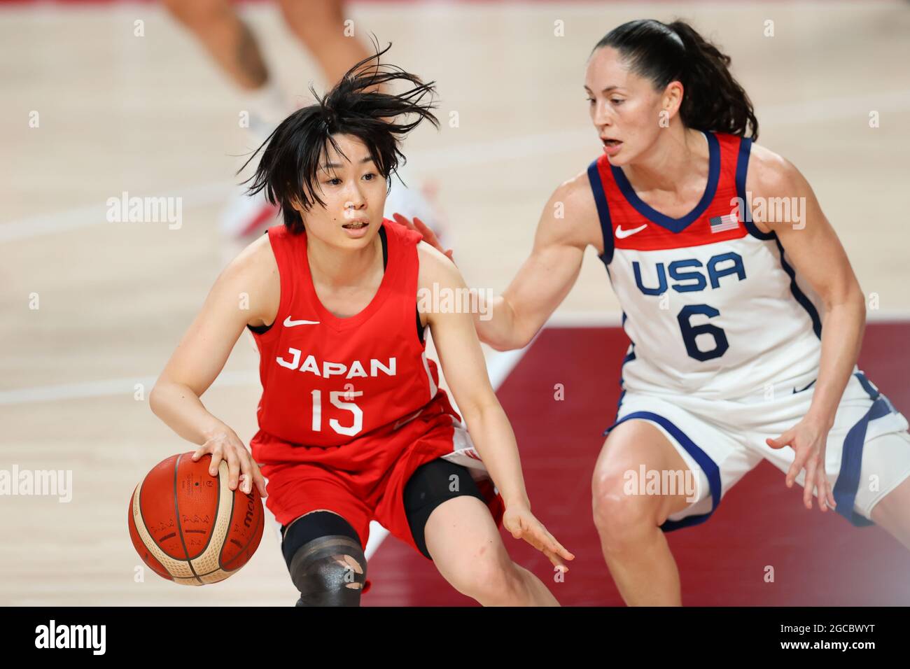 United States' Sue Bird (R) looks to pass the ball as she is defended by  France's Emmeline Ndongue during the USA-France Women's Basketball Gold  Medal Game at the 2012 Summer Olympics, August