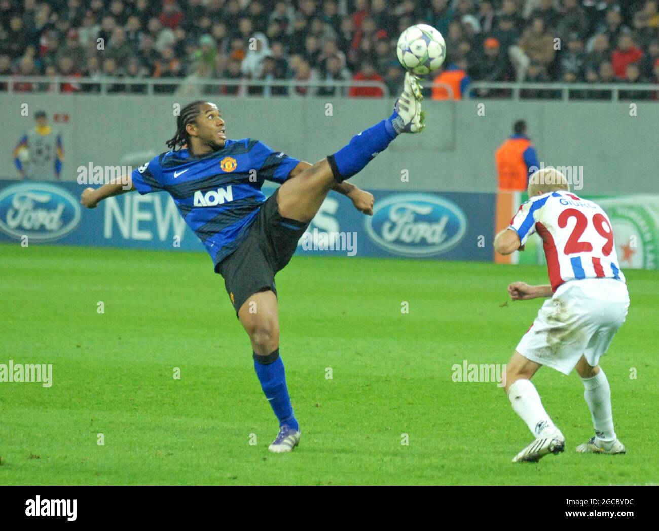 Anderson Esiti of Ferencvarosi TC challenges Luis Jakobi of Ujpest