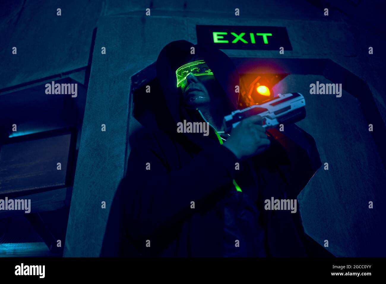 Man with blaster in the futuristic battle. Concept virtual reality, cyber  game and science fiction Stock Photo - Alamy