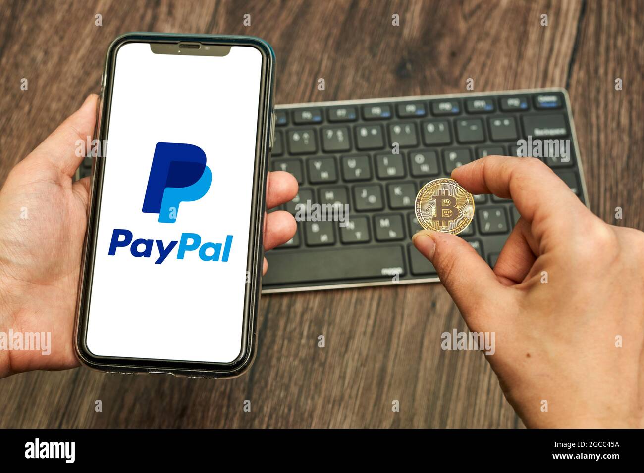 Tashkent, Uzbekistan - April 2, 2021: Hand holds a smartphone with PayPal  logo and bitcoin. Symbol of bitcoin cryptocurrency rolling out by online  Stock Photo - Alamy