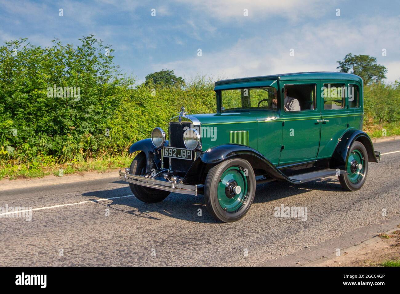 1929 20s twenties pre-war green Chevrolet Chevy INT.AC. 3137cc Landau sedan en-route to Capesthorne Hall classic July car show, Cheshire, UK Stock Photo