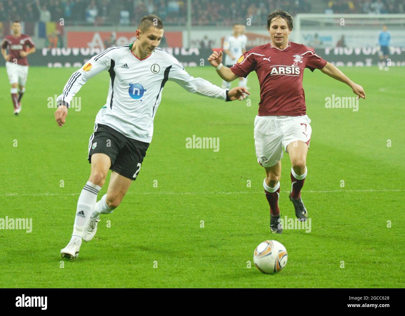BUCHAREST, ROMANIA - OCTOBER 20, 2011: Artur Jedrzejczyk (L) of Legia and Ciprian Deac (R) of Rapid pictured during the UEFA Europa League Group C game between Rapid Bucuresti and Legia Warszawa at National Arena. Stock Photo