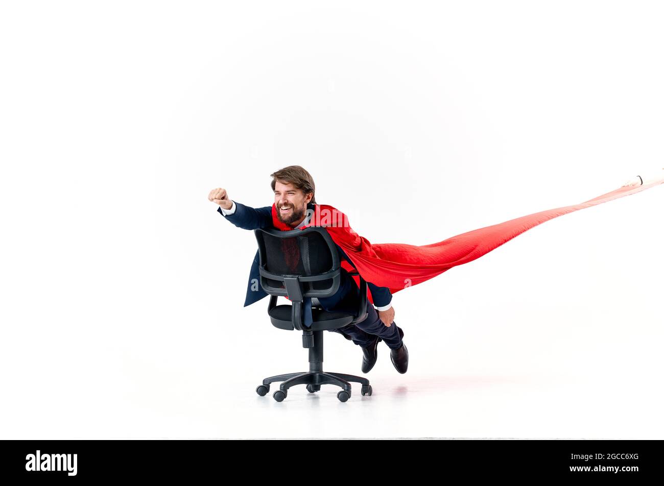 business man with red cloak trying in superman office chair Stock Photo ...