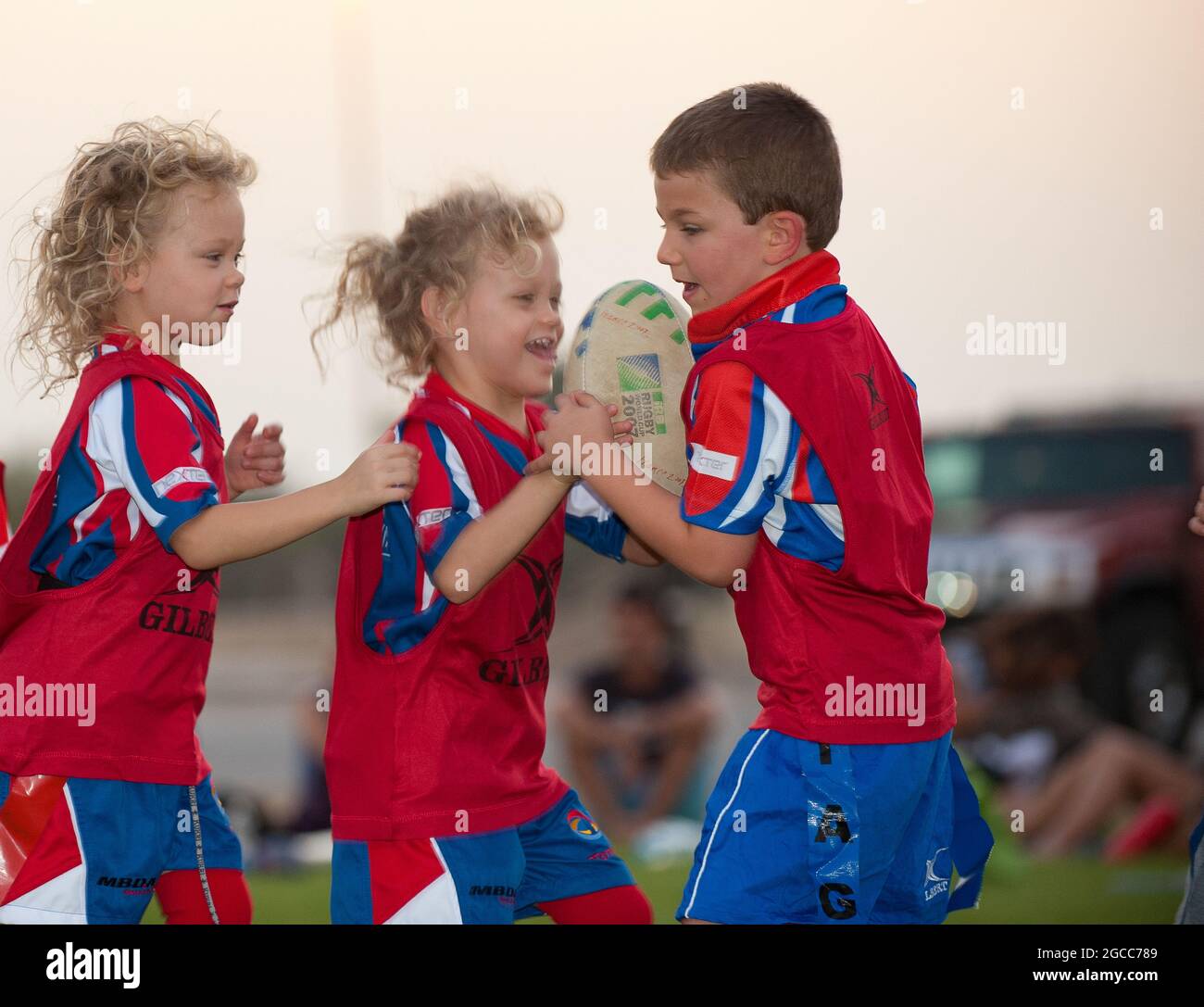 young kids playing rugby in abu dhabi Stock Photo Alamy