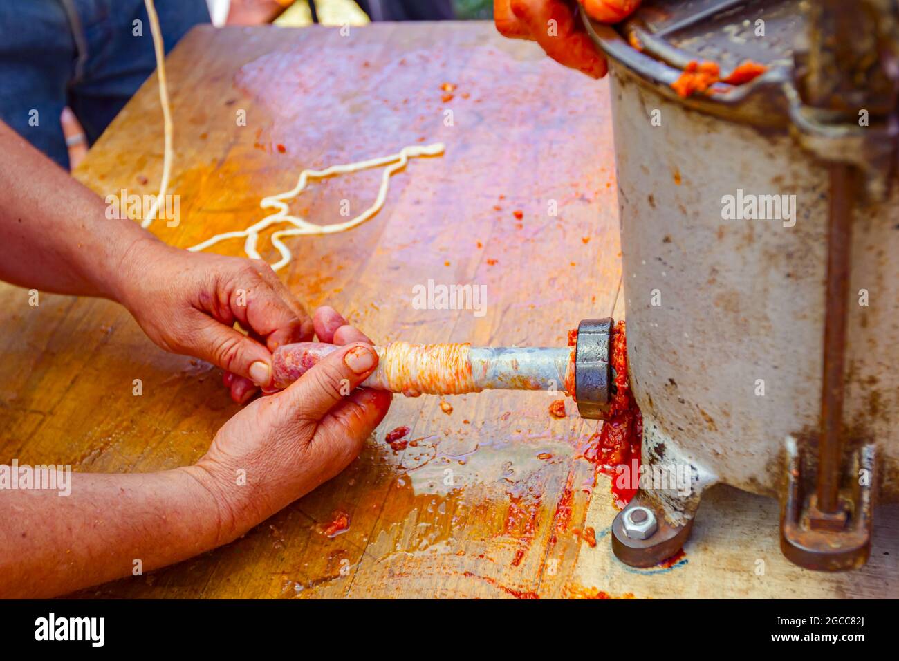 Fill up pig intestines to make sausage with machine for handmade