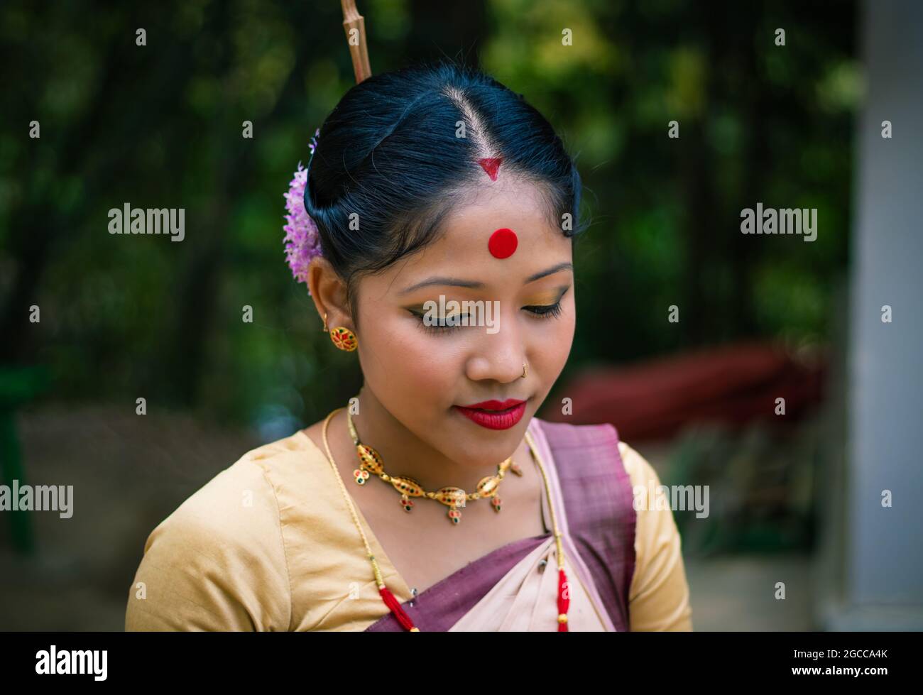 girl close up portrait isolated dressed in traditional wearing on festival with blurred background image is taken on the occasion of bihu at assam ind Stock Photo