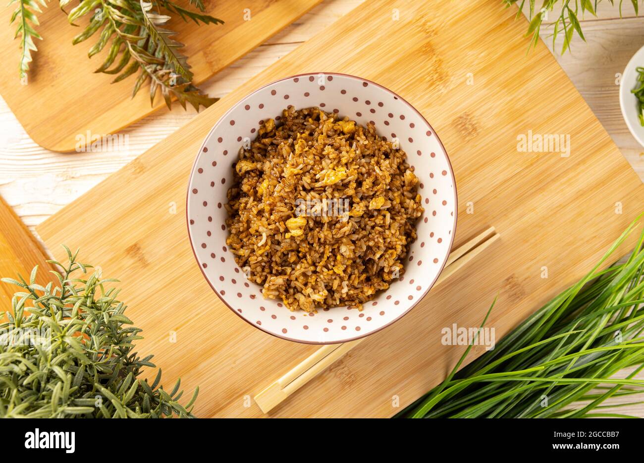 Top view fried rice in the bowl on the wooden table Stock Photo