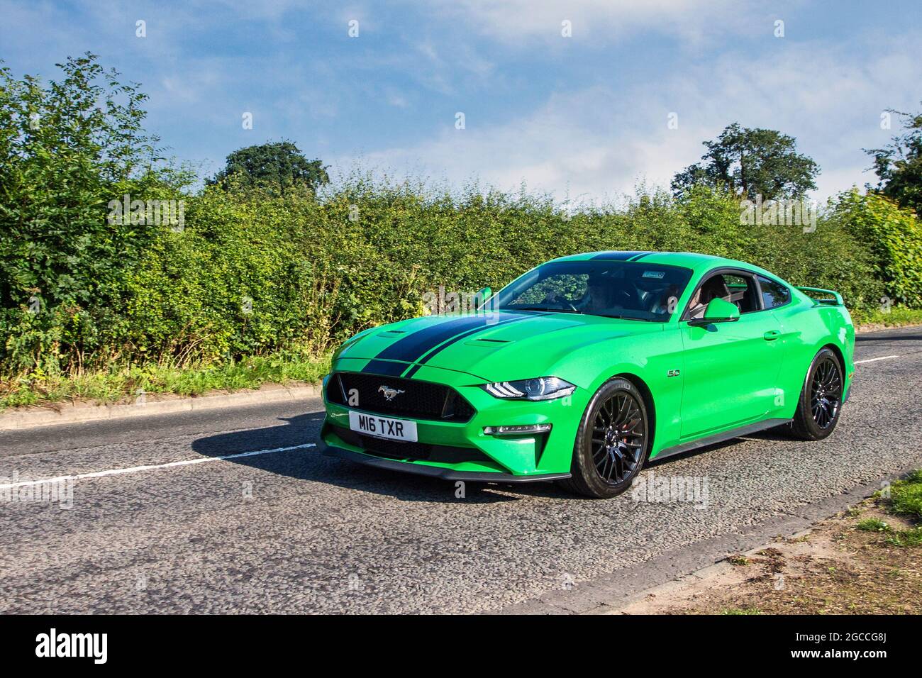 2019 green Ford Mustang GT auto 5.0 litre 2dr coupe en-route to Capesthorne  Hall classic July car show, Cheshire, UK Stock Photo - Alamy