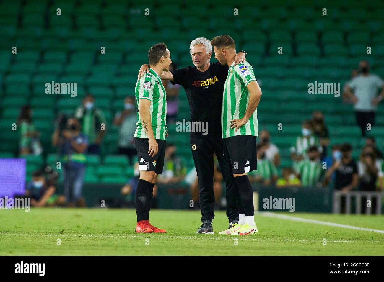 Jose Mourinho, head coach of Roma with Andres Guardado, Joaquin Sanchez of  Real Betis during the Pre-Season friendly football match between Real Betis  Balompie and AS Roma on August 7, 2021 at