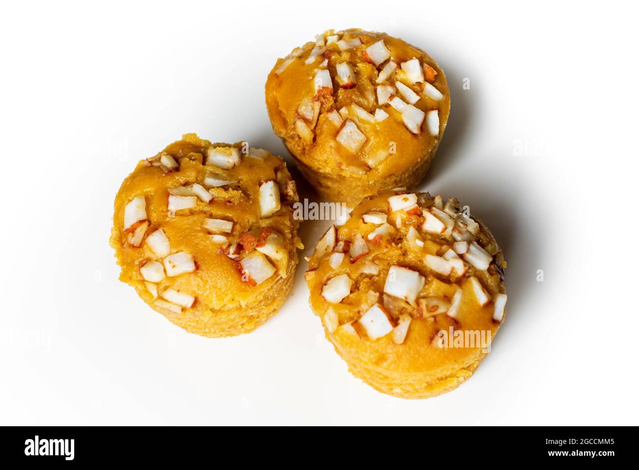 3 pieces popular and yummy traditional cake made with raw ripe palmyra palm fruit juice. Steamed palmyra palm cake in isolated white background. Stock Photo