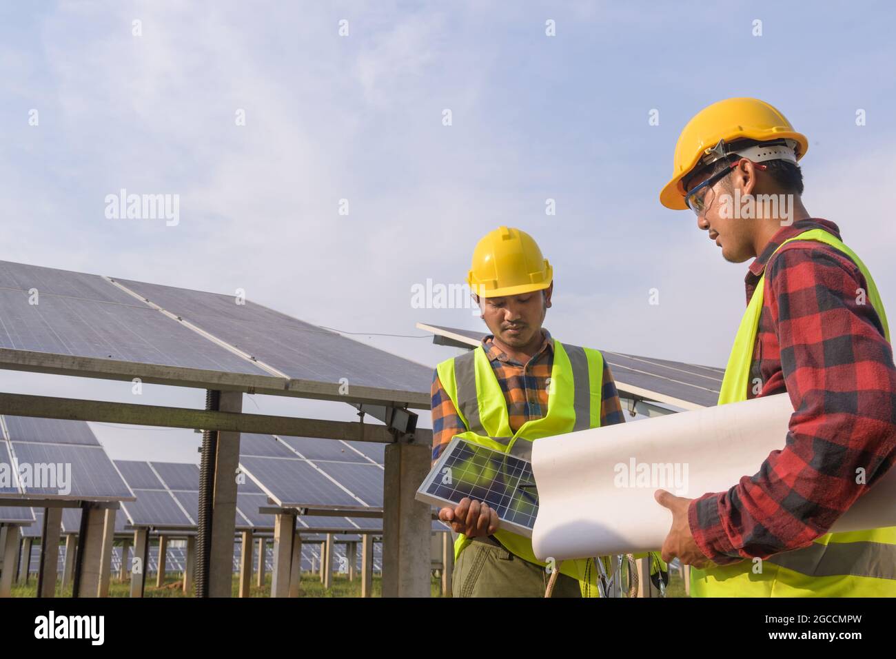 engineer working on checking equipment in solar power plant Stock Photo