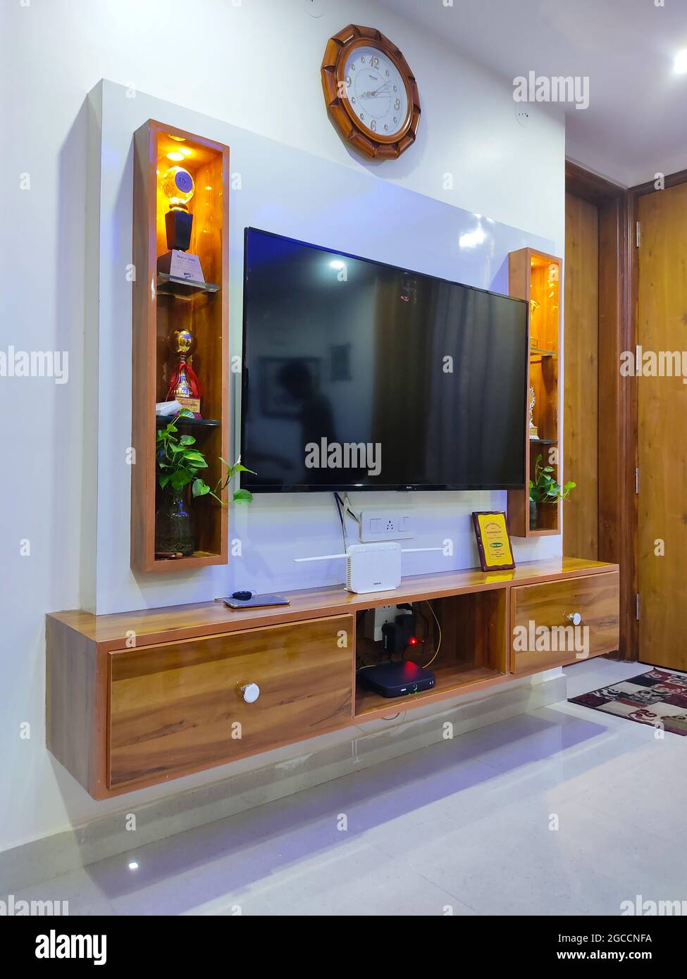 Wall Hanging Television Showcase Cabinet with Wooden Panel, Shelving Racks display and drawer. Home Interior. Stock Photo
