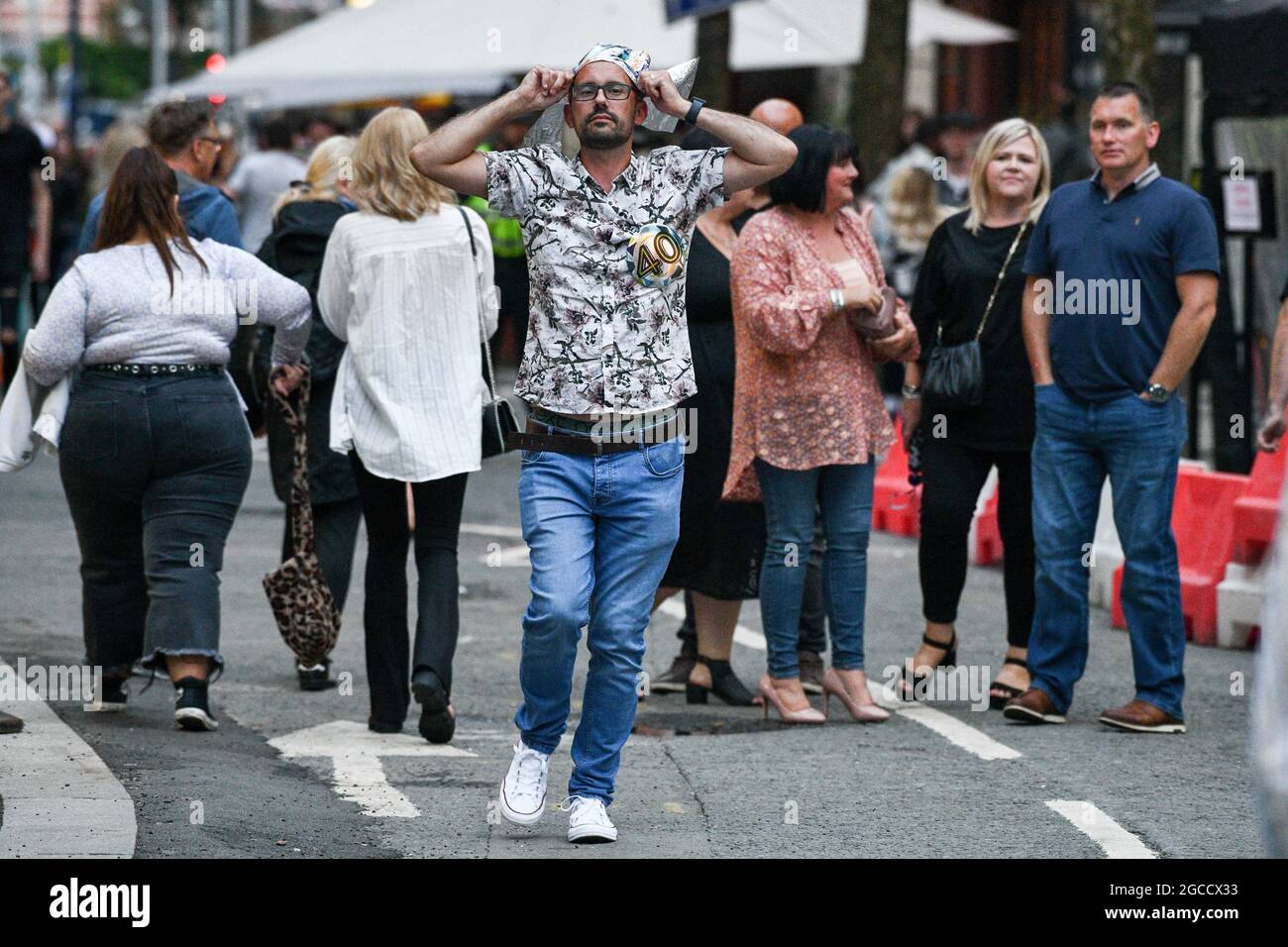 Club goers hit Wind Street in Swansea, on Saturday night as nightclubs open across Wales for the first time since the start of the pandemic, as well as facemask restriction being no longer mandatory inside pubs. Stock Photo