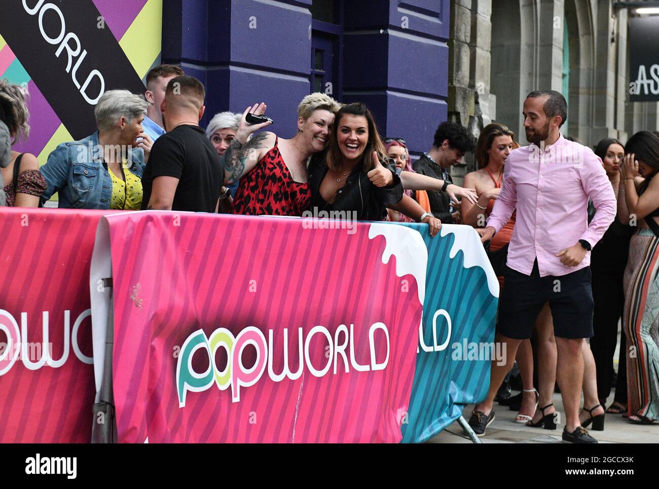 Club goers queue outside Popworld on Wind Street in Swansea, on Saturday night as nightclubs open across Wales for the first time since the start of the pandemic, as well as facemask restriction being no longer mandatory inside pubs. Stock Photo