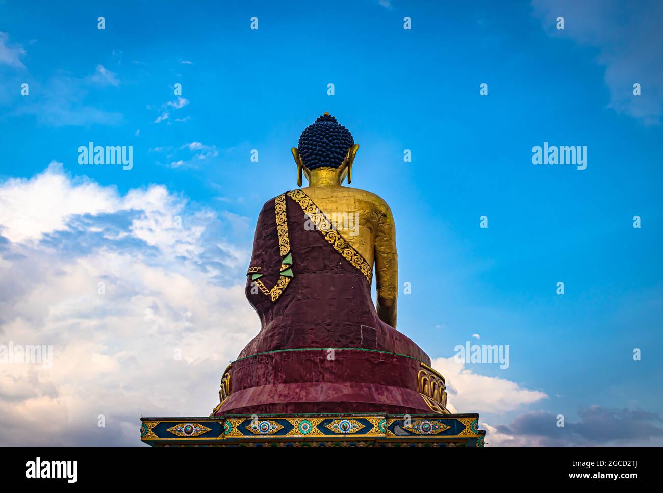 huge buddha golden statue from different perspective with bright blue sky at evening image is taken at giant buddha statue tawang arunachal pradesh in Stock Photo
