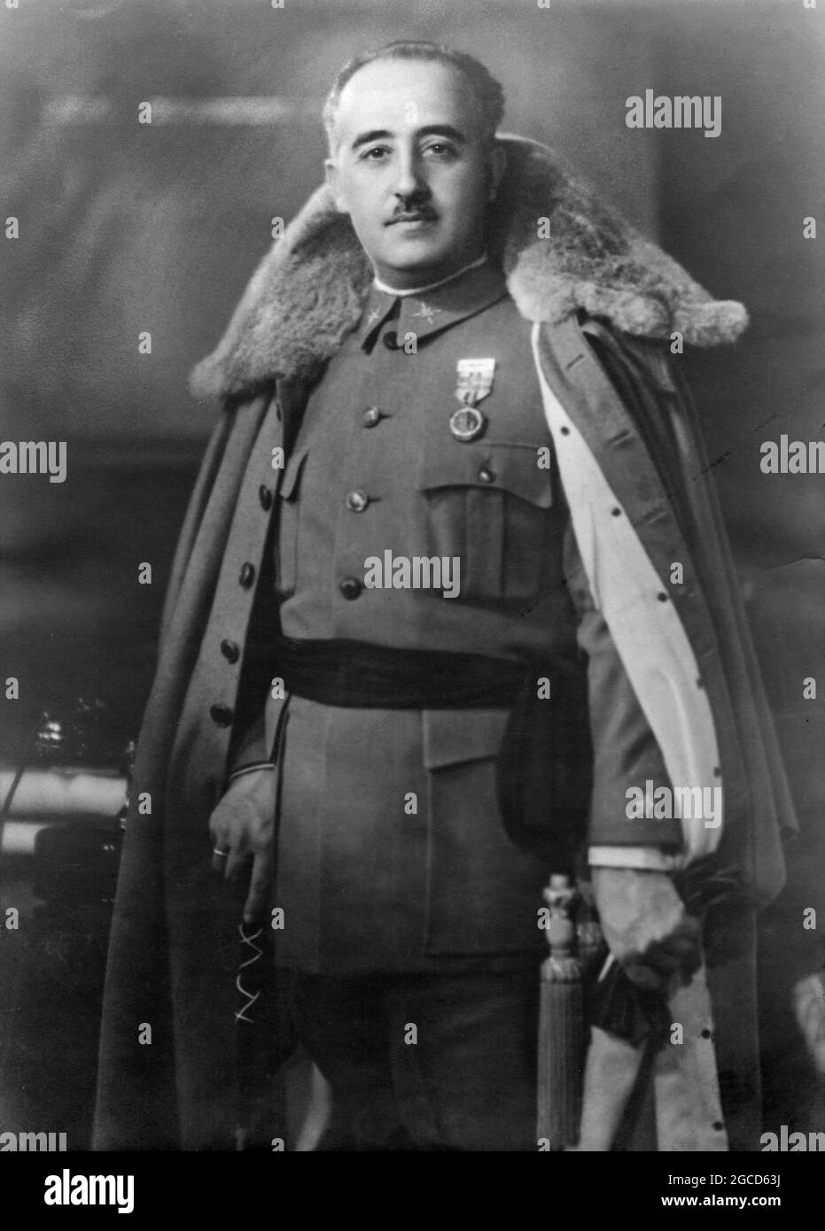 SPAIN - 1930 - Formal studio portrait of the Spanish dictator General Francisco Franco (right 1892-1975) in a winter cape - Photo: Geopix Stock Photo
