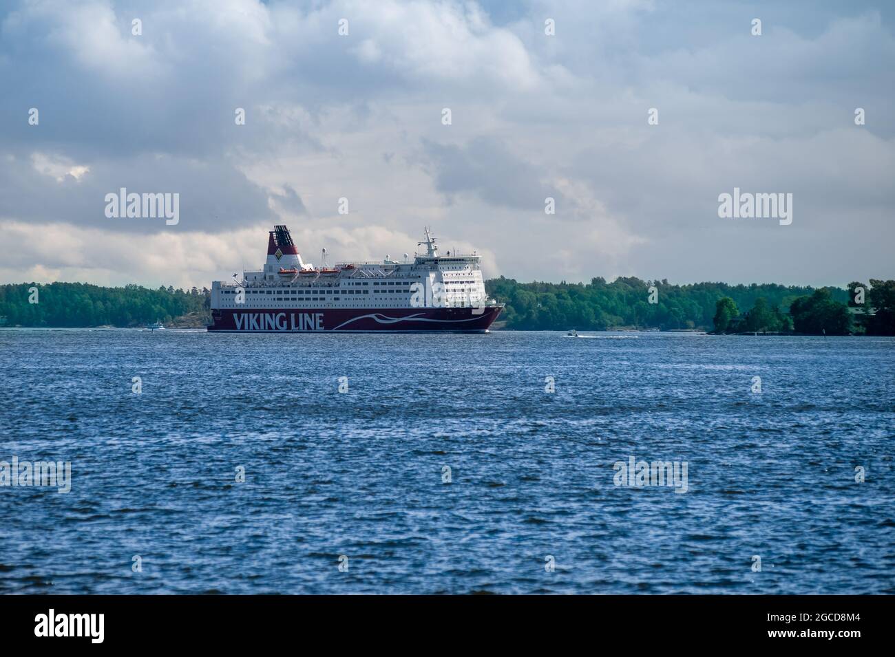Helsinki / Finland - July 30, 2020: A large passenger RORO-ferry MV Mariella, operated by Viking Line, making a hard turn in the Finnish archipelago. Stock Photo