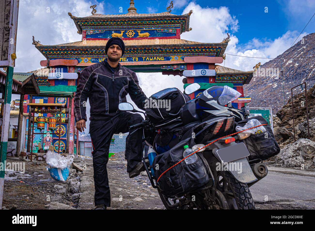 solo young bike ridder man with his loaded bike at mountain pass at day from flat angle image is taken at sela pass tawang arunachal pradesh india. it Stock Photo