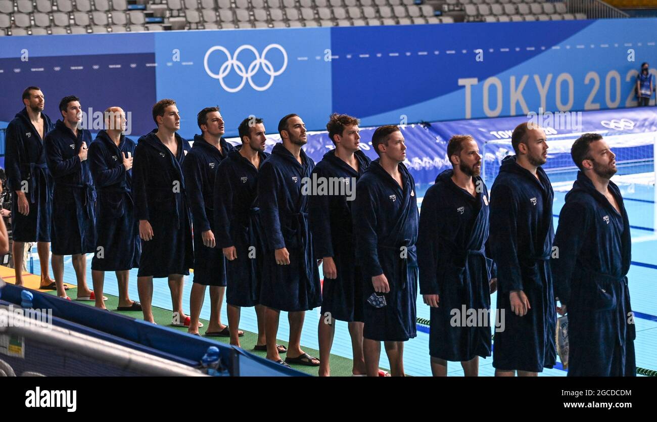 Tokyo, Japan. 8th Aug, 2021. Members of Team Serbia stand and salute as national anthem is played before the men's water polo final at Tokyo 2020 Olympic Games, in Tokyo, Japan, Aug. 8, 2021. Credit: Xia Yifang/Xinhua/Alamy Live News Stock Photo