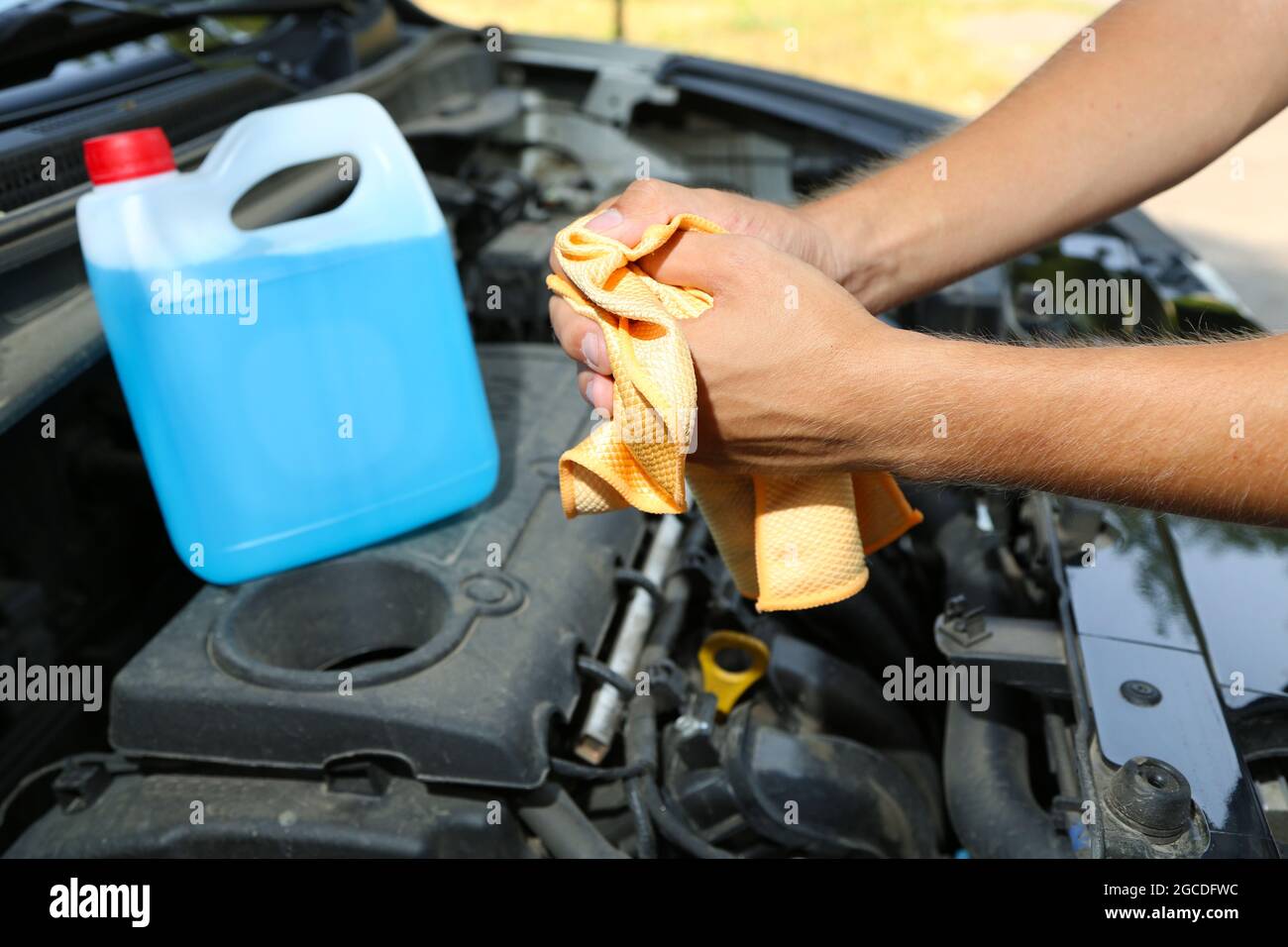Motor mechanic cleaning his greasy hands after servicing car Stock Photo Alamy