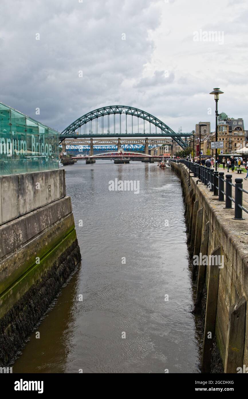 Looking up river at the Tyne Bridges in Newcastle from the Gateshead Millenium Bridge in Tyne and Wear, North East England Stock Photo