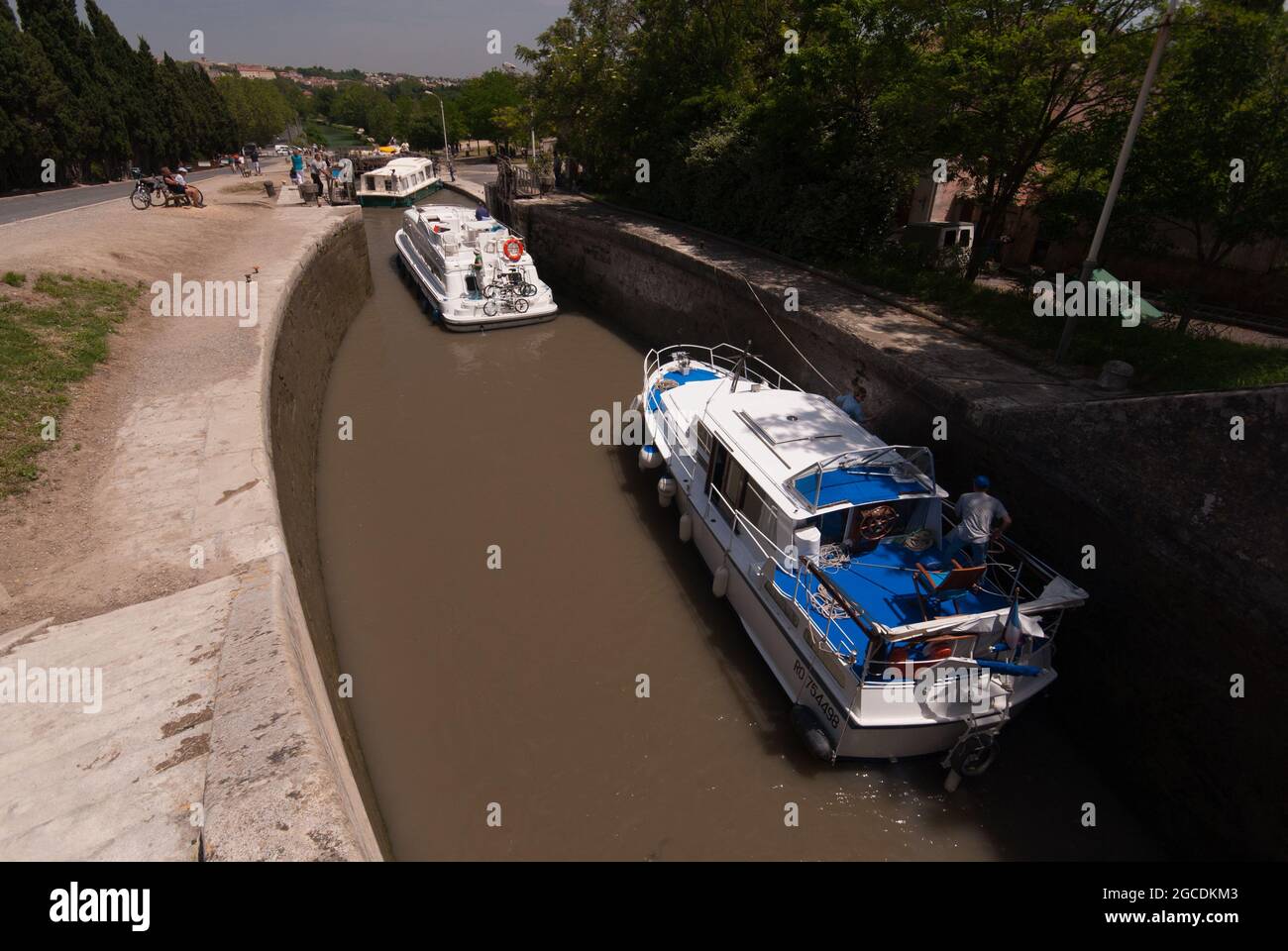 Boats in the staircase locks of Fonseranes at the Canal du Midi near Bézier Stock Photo