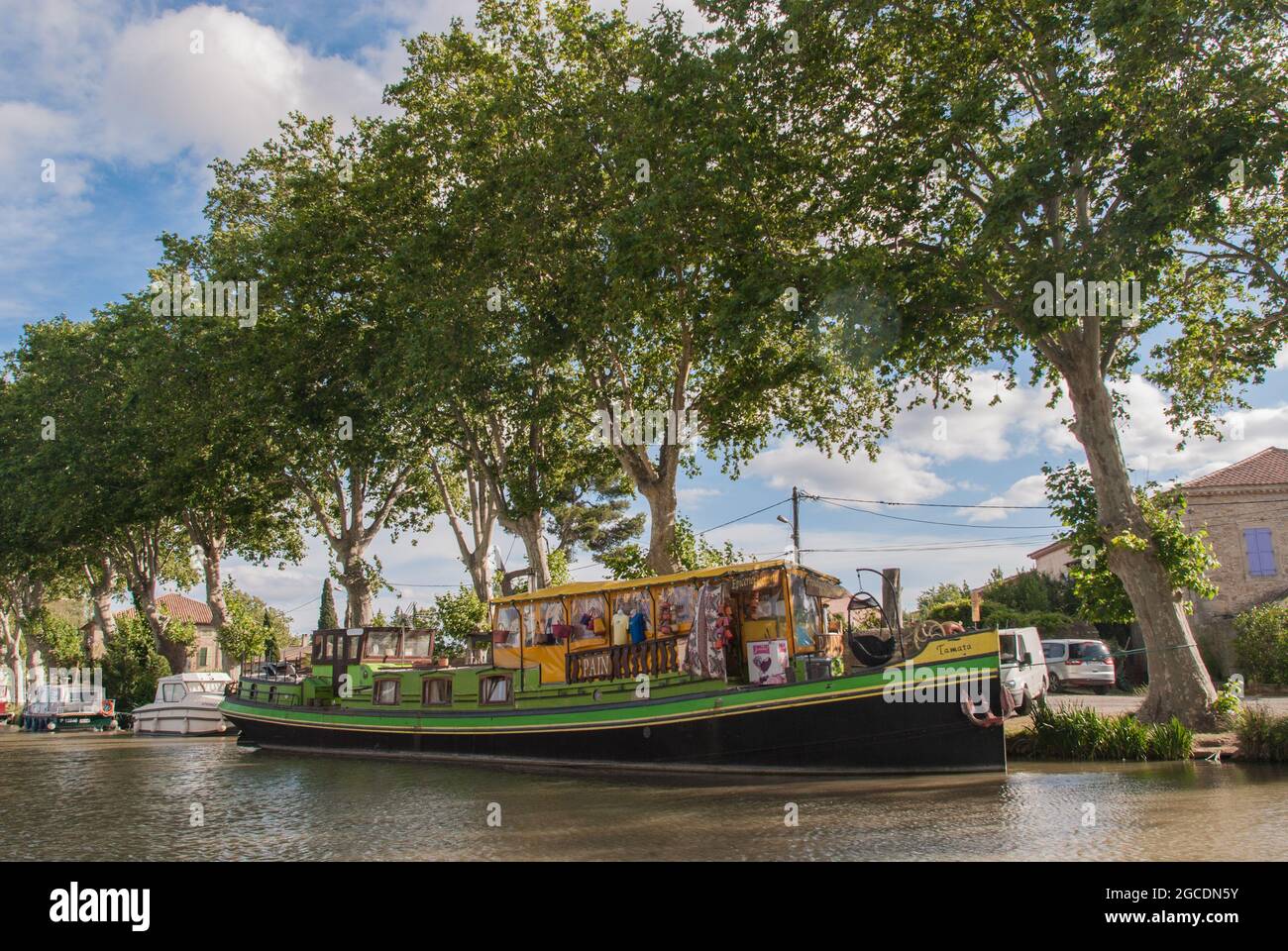 A floating corner shop on the Canal du Midi at Somail. Stock Photo
