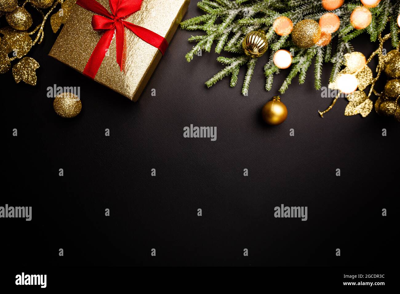 Christmas holidays composition with gold decorations on black ...