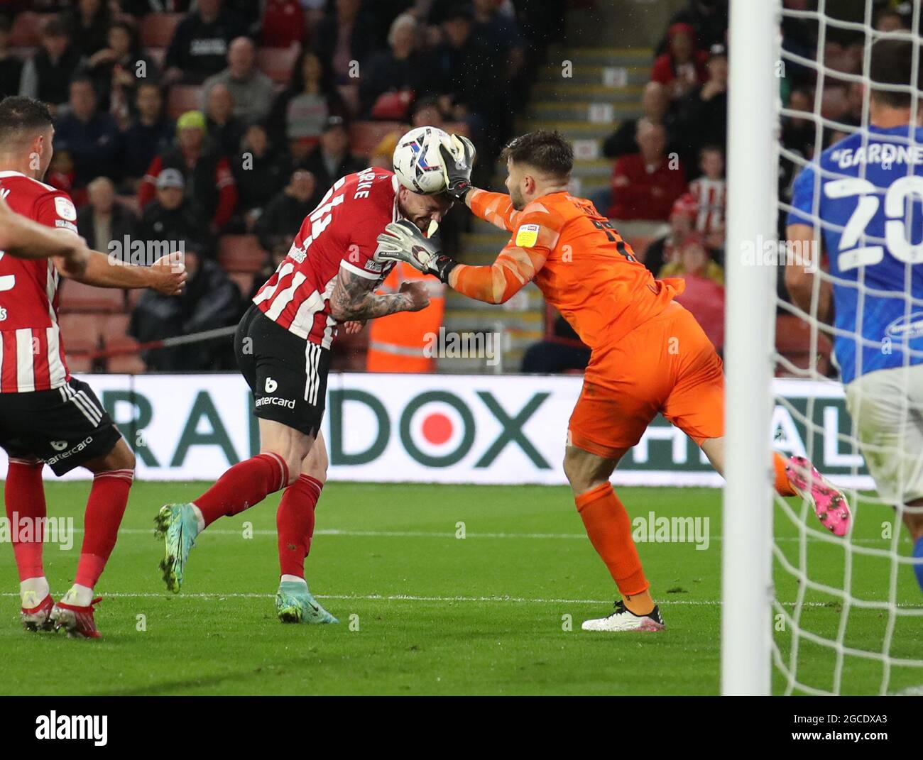 Sheffield, England, 7th August 2021. Matija Sarkic of Birmingham City knocks the ball off the head of Oliver Burke of Sheffield Utd  during the Sky Bet Championship match at Bramall Lane, Sheffield. Picture credit should read: Simon Bellis / Sportimage Stock Photo