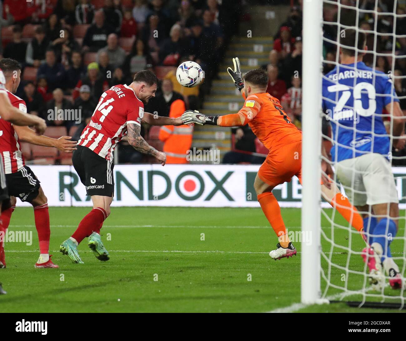 Sheffield, England, 7th August 2021. Matija Sarkic of Birmingham City knocks the ball off the head of Oliver Burke of Sheffield Utd  during the Sky Bet Championship match at Bramall Lane, Sheffield. Picture credit should read: Simon Bellis / Sportimage Stock Photo