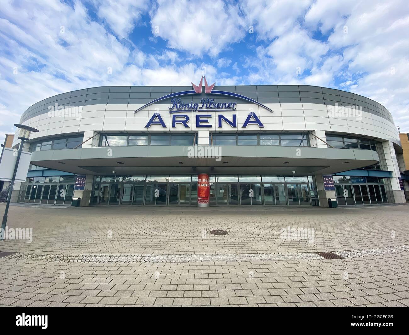 Oberhausen, Germany - July 9. 2021: View over square on modern buildung konig pilsener arena ageins blue summer sky with clouds Stock Photo