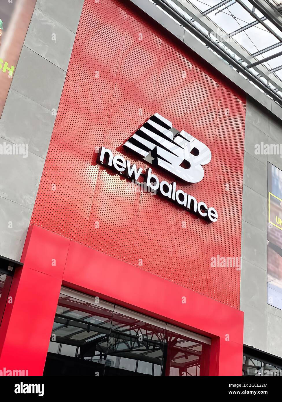 Oberhausen, Germany - July 9. 2021: View on store front with logo lettering  of new balance shoe fashion in shopping mall Stock Photo - Alamy