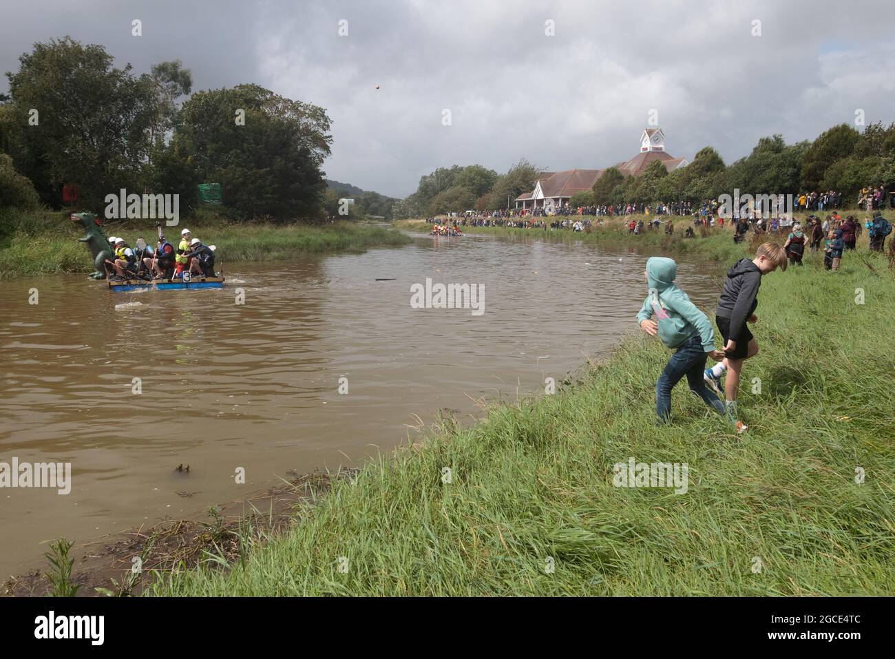 Lewes, East Sussex, UK. 9th July, 2021. Lewes to Newhaven Raft Race participants face a barrage of eggs and flour thrown by spectators. Credit: Andy Sillett/Alamy Live News Stock Photo