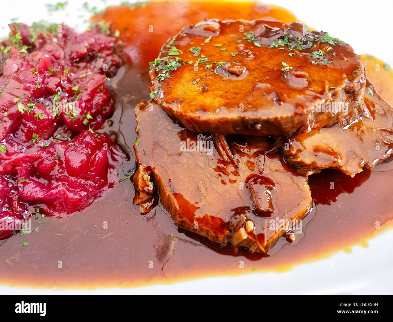 Delicious cooking Roast beef with sauce and red cabbage Stock Photo