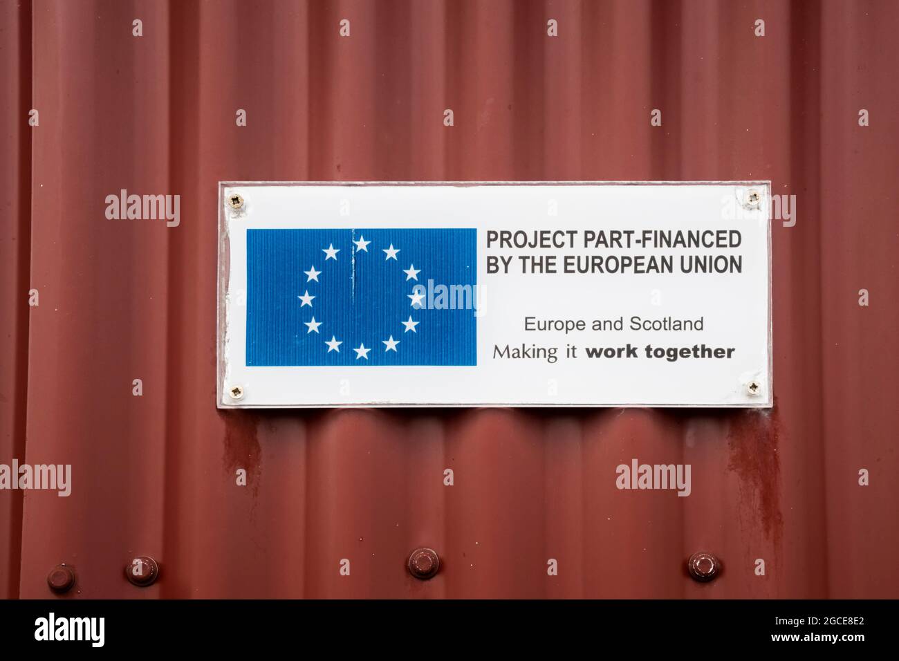 Gratitude plaque sign reading Project Part-Financed by the EU, Europe & Scotland Making It Work Together on Sellafirth Business Park, Yell. Stock Photo